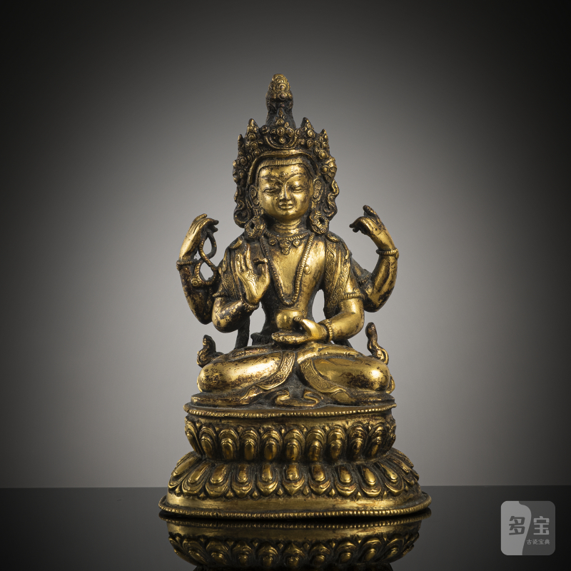 A gilt-bronze of a four-armed Bodhisattva
